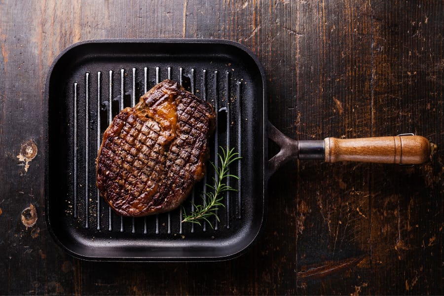 cooking steak with grill pan